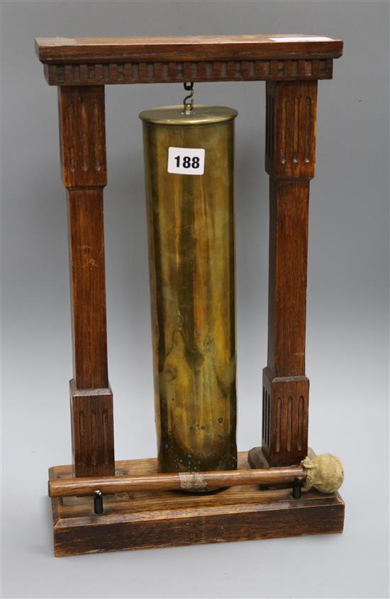 A table gong, made from a bomb shell height 45.5cm